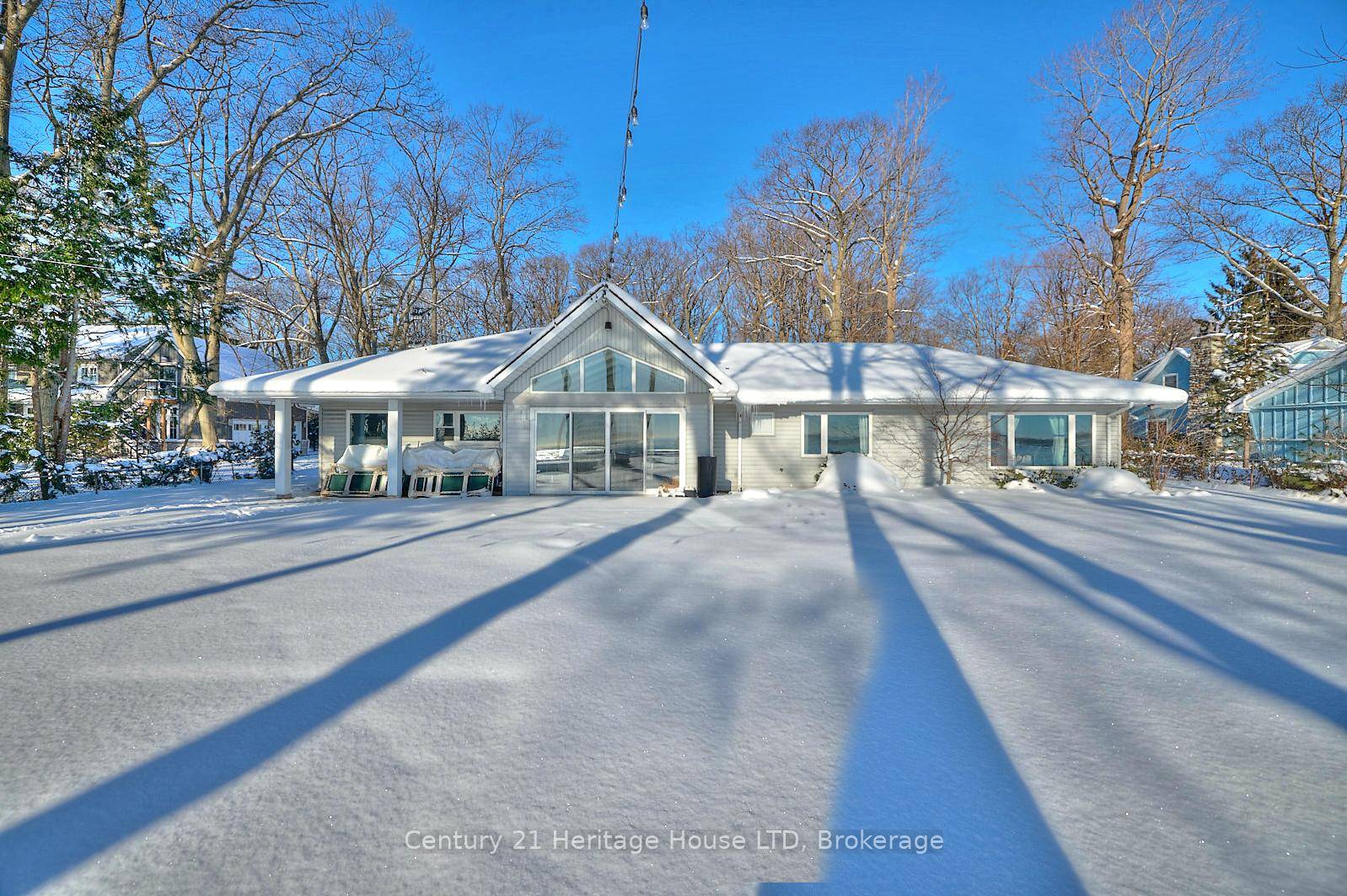 Investors, take note ! REMODELLED LAKE ERIE WATERFRONT HOME with a detached second dwelling guest bunkie on the sandy shores of Lake Erie in Cedar Bay near Sherkston Shores !