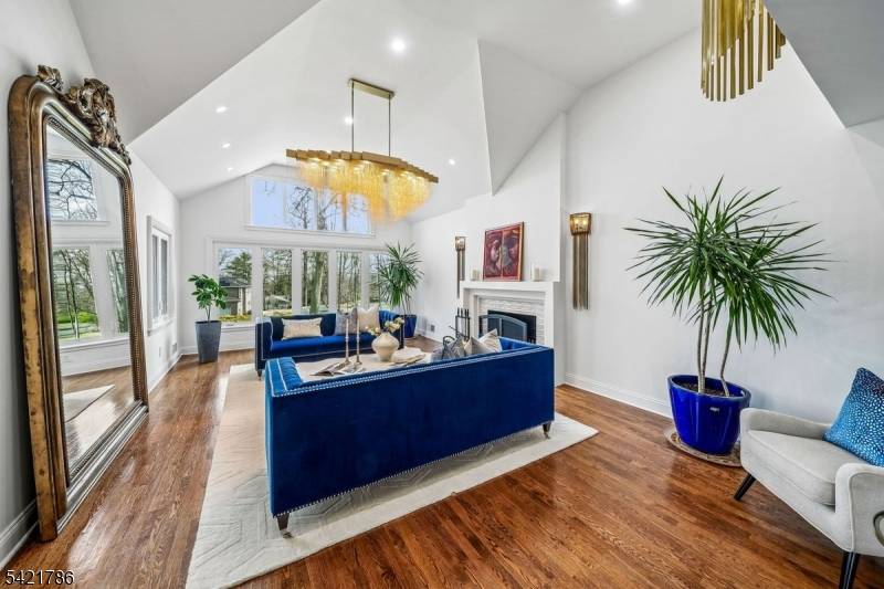 Absolutely stunning, this fully renovated 6 bedroom, 5 full and 2 half bath raised ranch is perched on a hilltop and drenched in natural light, offering tranquility, relaxation, and a ...