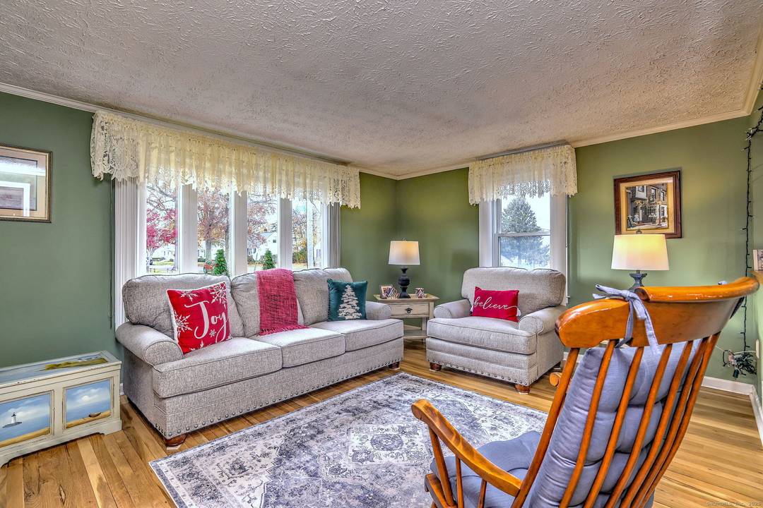 Updated 2 3 BR cape with 2 full baths and 1 car garage.