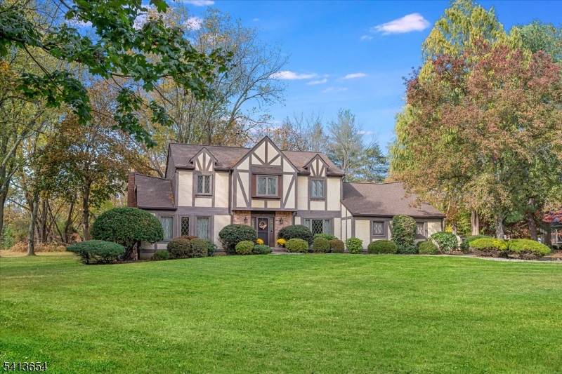Classic Tudor charm set on nearly one acre in a sought after Branchburg neighborhood.