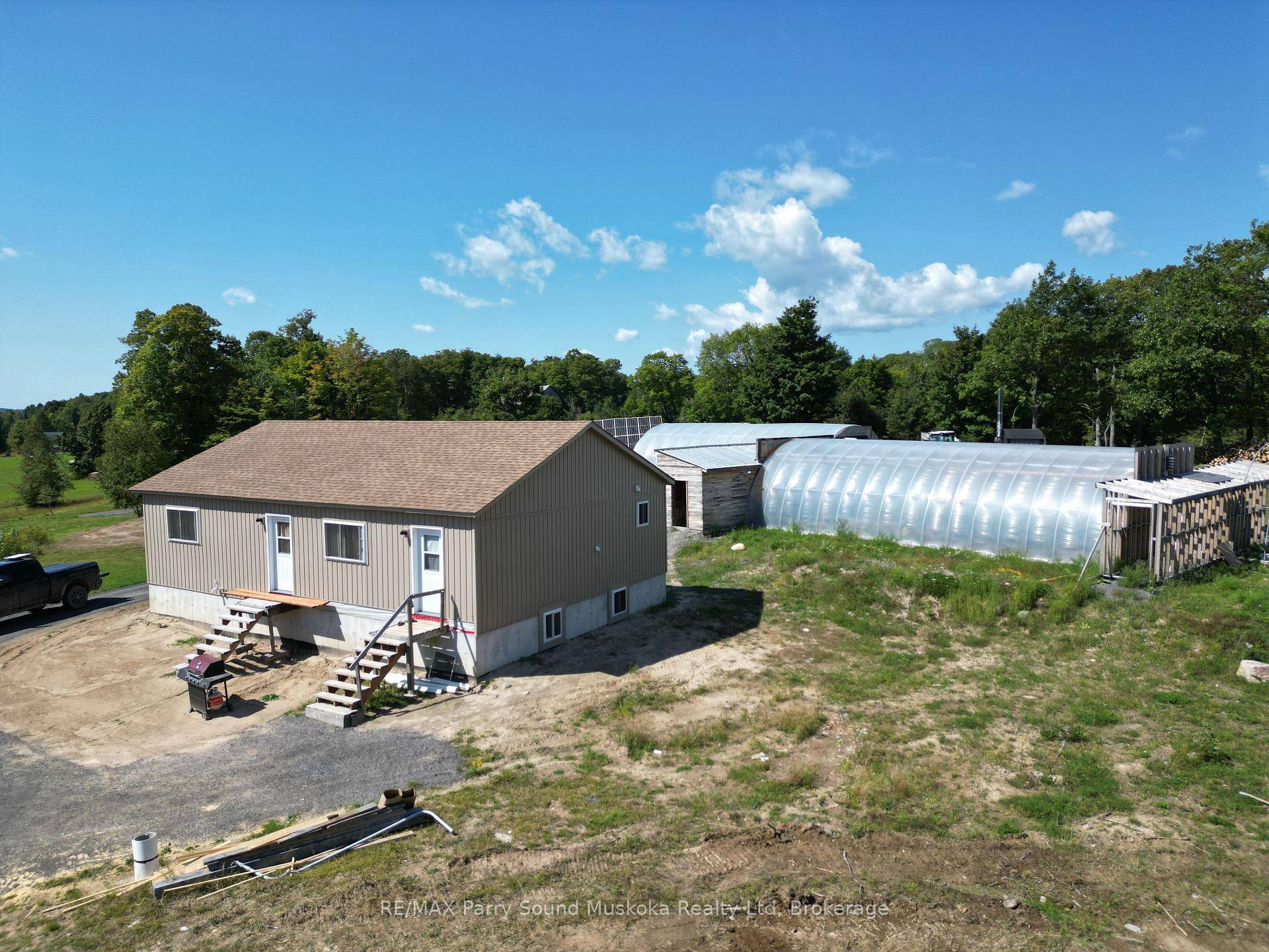 This newly built house is off grid, situated on 52 acres with a large oversized garage and set up as a turnkey business with huge potential.