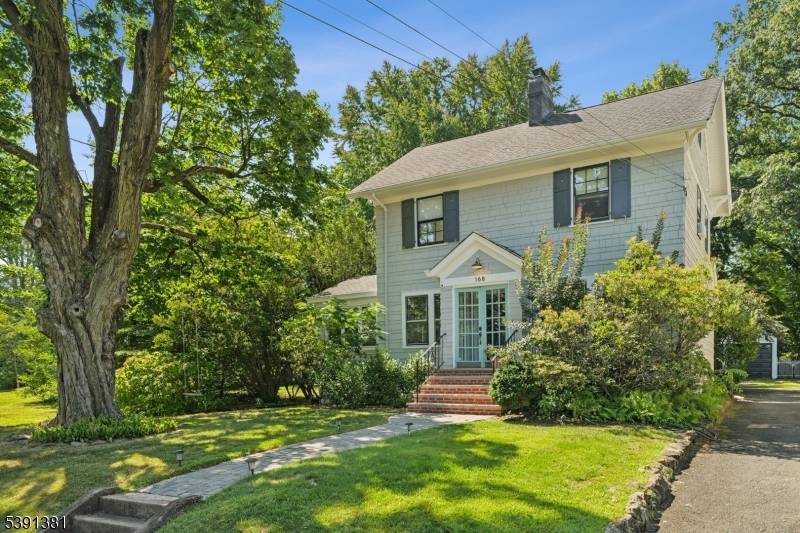 Visit this chic Colonial home where timeless Maplewood charm meets thoughtful modern updates !