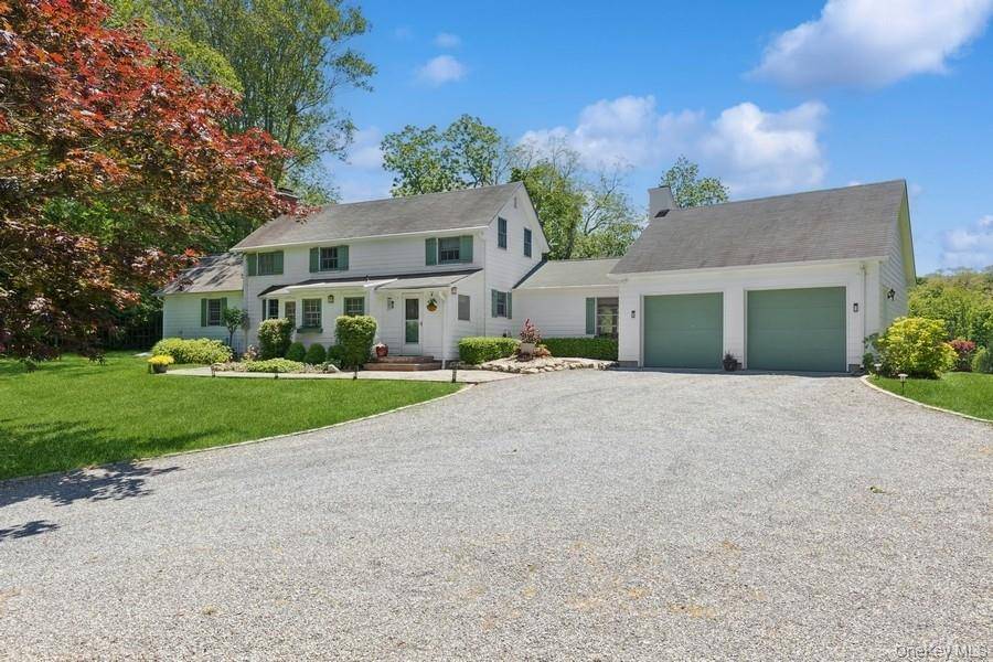 Nestled in a storybook setting where history, nature, and charm converge in this enchanting carriage house overlooking the serene waters of Mill Pond in Wading River.