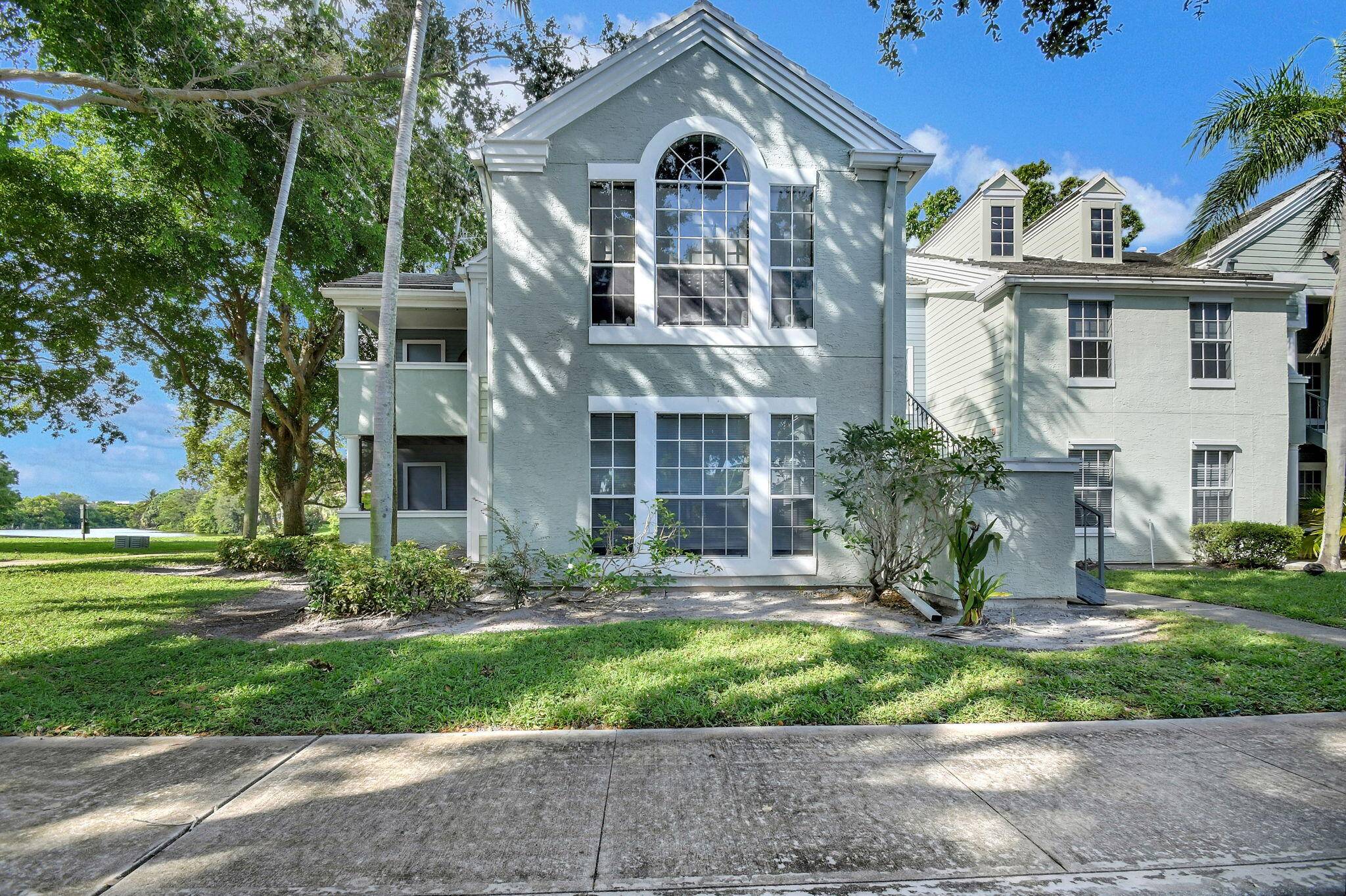 Top floor corner offers tranquil lake views from the balcony.