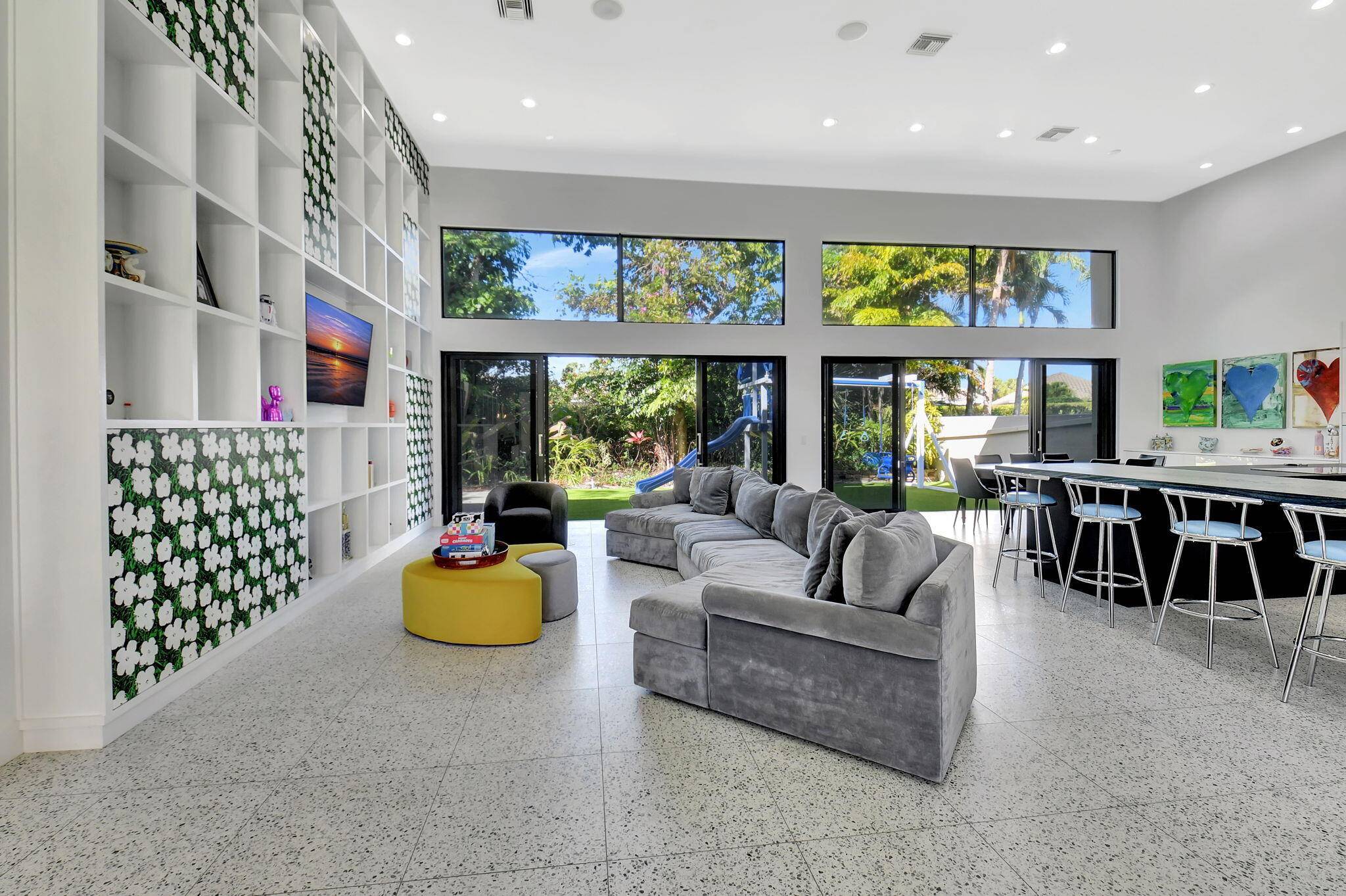 Experience luxury living at its finest in this elegant meticulously renovated 6 bedroom, 6 bath modern courtyard estate, located in the prestigious Vintage Place subdivision of Broken Sound.