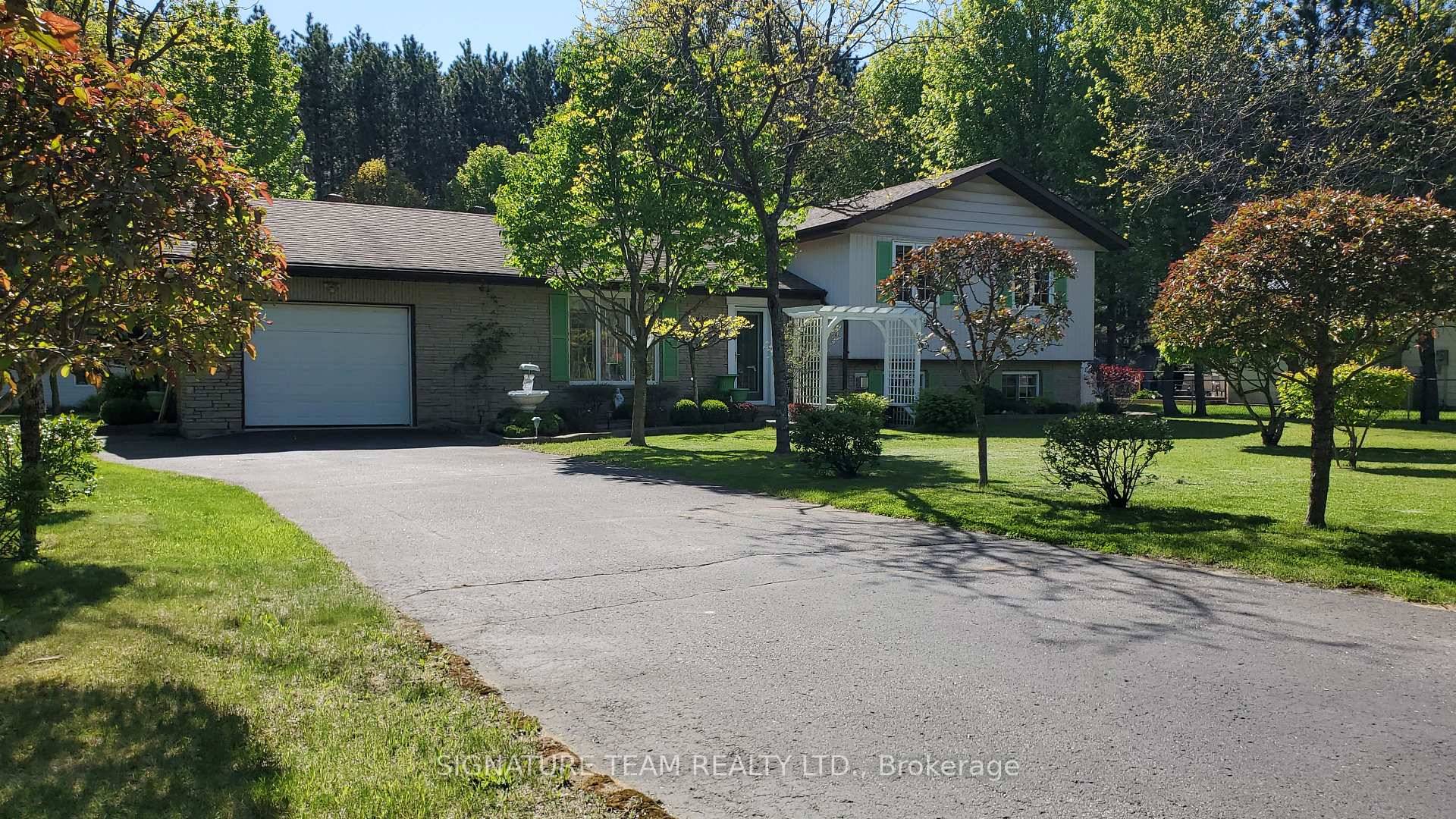 Very well taken care of 4 bedroom, 2 bathroom raised ranch home with single car garage with paved driveway, fenced yard and a very nicely landscaped and manicured yard.