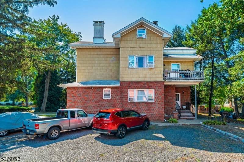 Welcome to 403 Somerset Street, a stately Victorian nestled on a corner lot in the heart of Bound Brook.