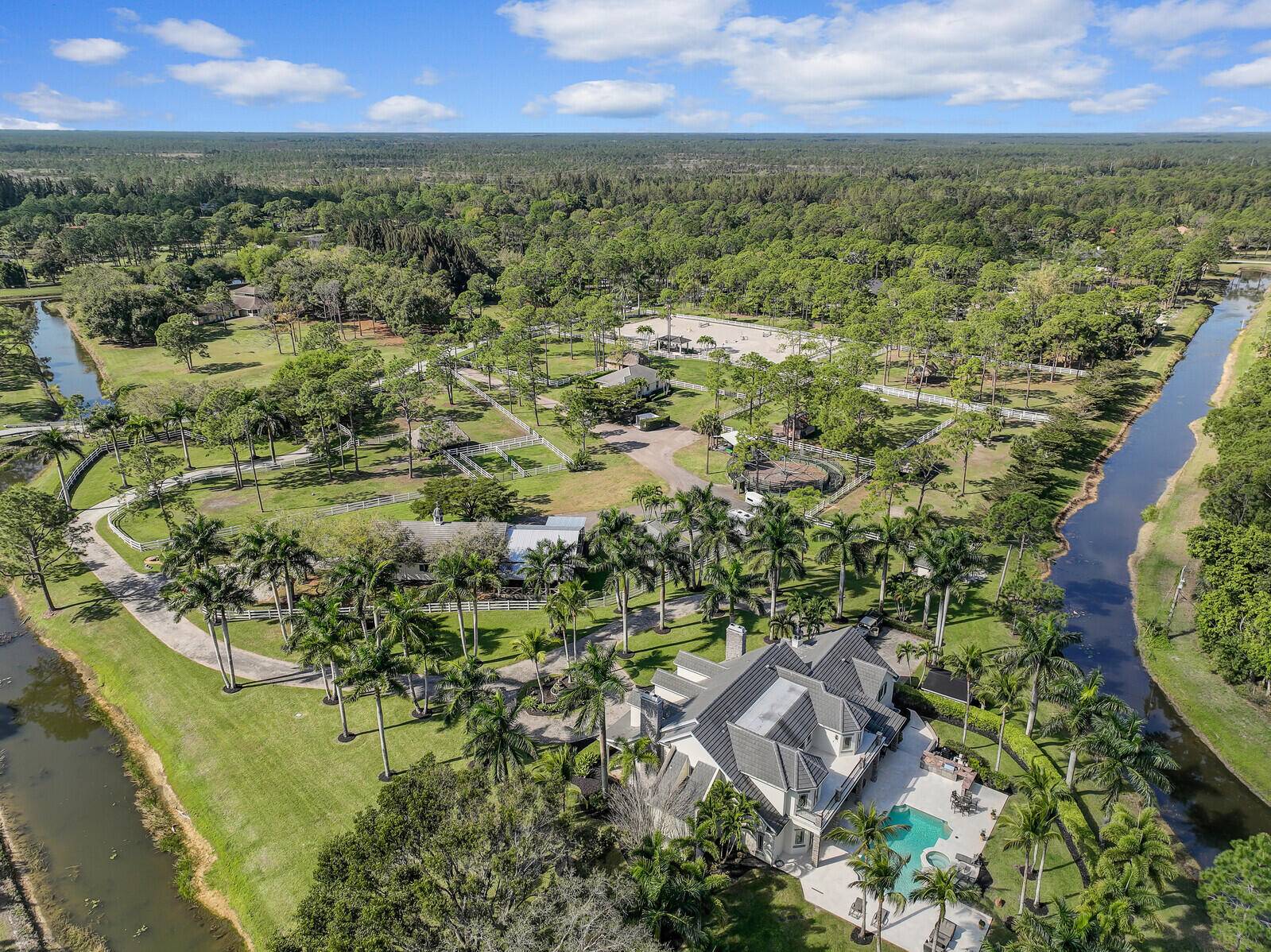 Equestrian Estate in Caloosa 14639 Crazy Horse Lane, Palm Beach GardensExperience the ultimate in luxury equestrian living at 14639 Crazy Horse Lane, a 10 acre estate in the prestigious Caloosa ...