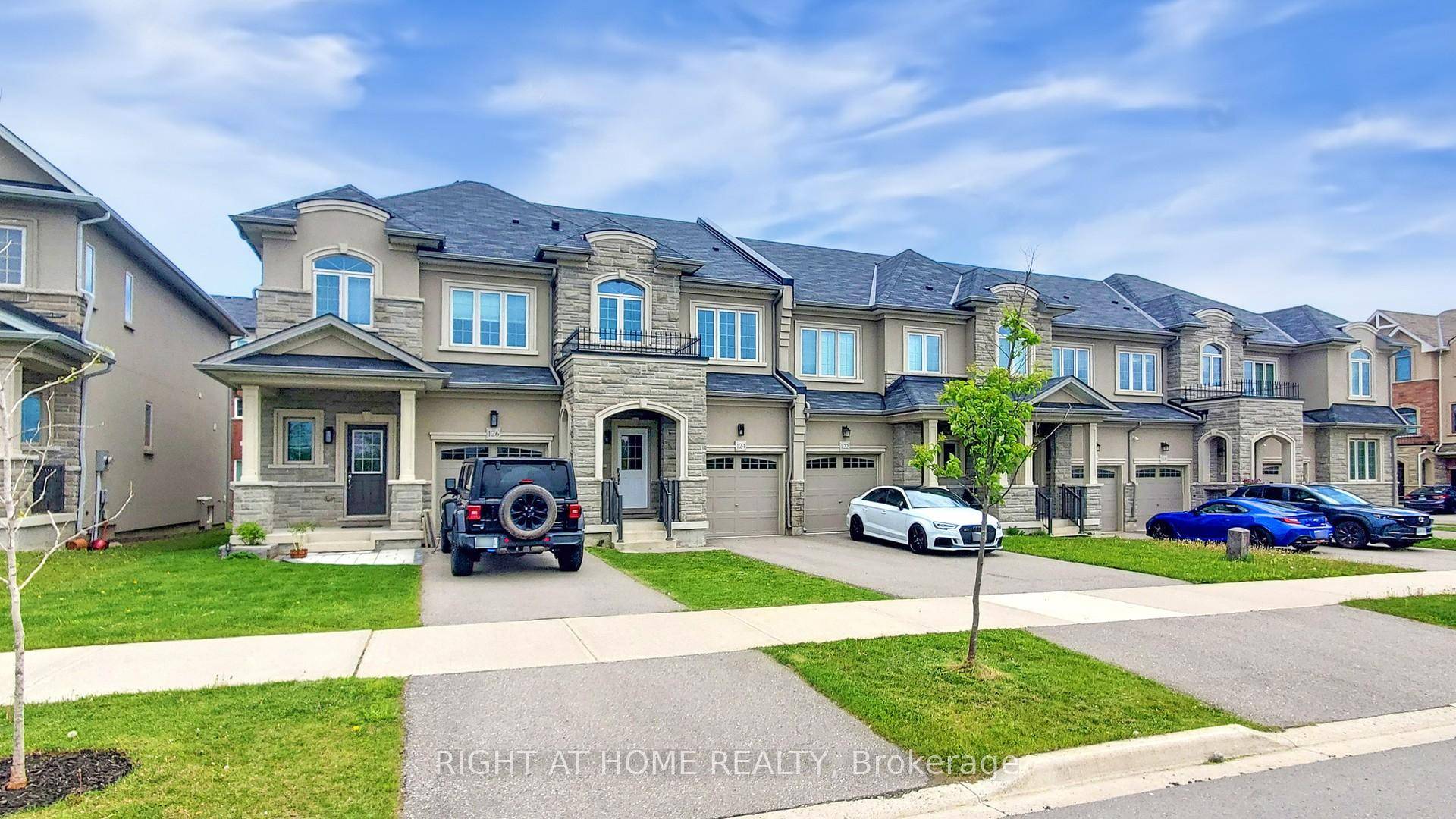 Welcome to 124 Mosaic Dr, a Truly Freehold Townhouse no POTL Road Fee.