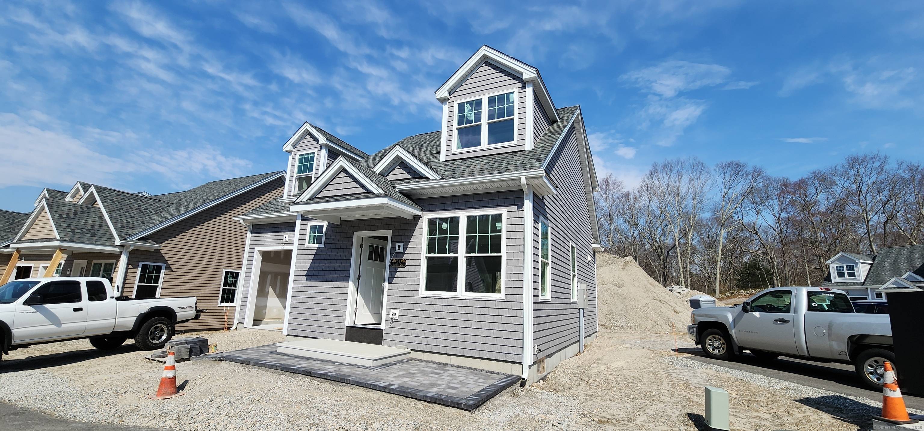 Under construction in Ivy Hill Village, a new subdivision in the Great Neck section of Waterford, consisting of 40 quaint Nantucket style homes built by Adams Builders LLC with an ...