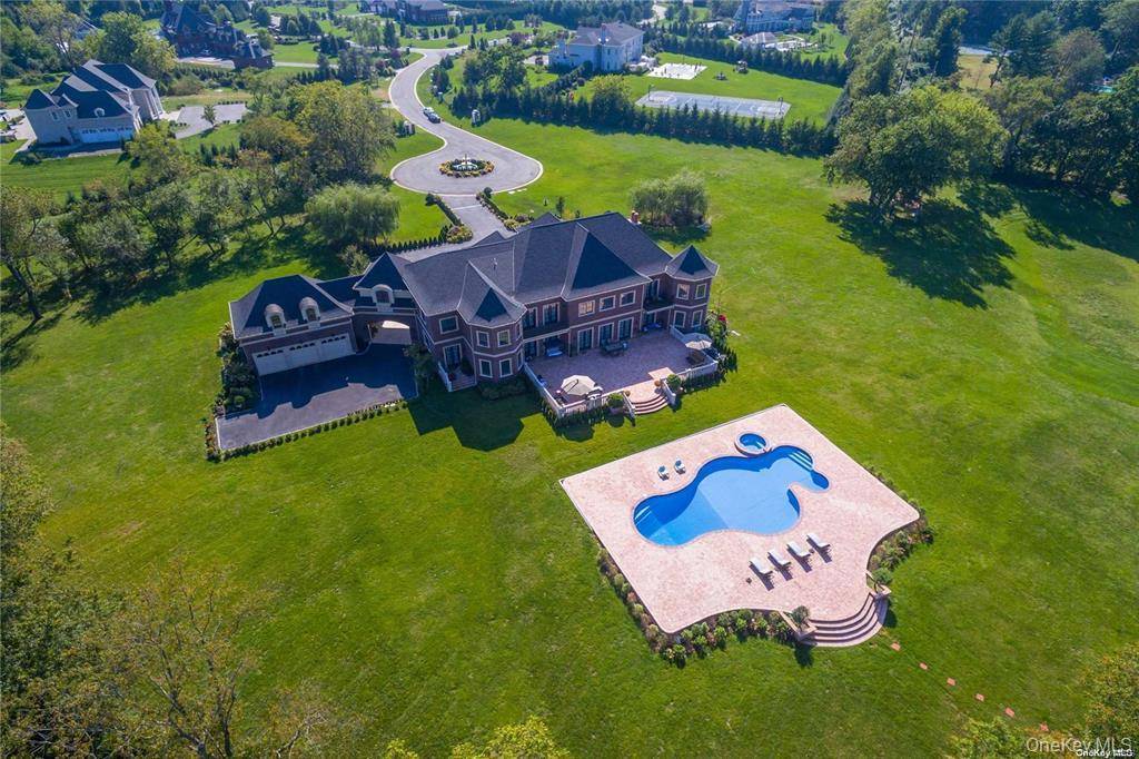 Nestled in the prestigious Greenfield Estates of Old Brookville, this 10, 000 sq ft brick colonial estate is a masterpiece of luxury and privacy on 6 acres.