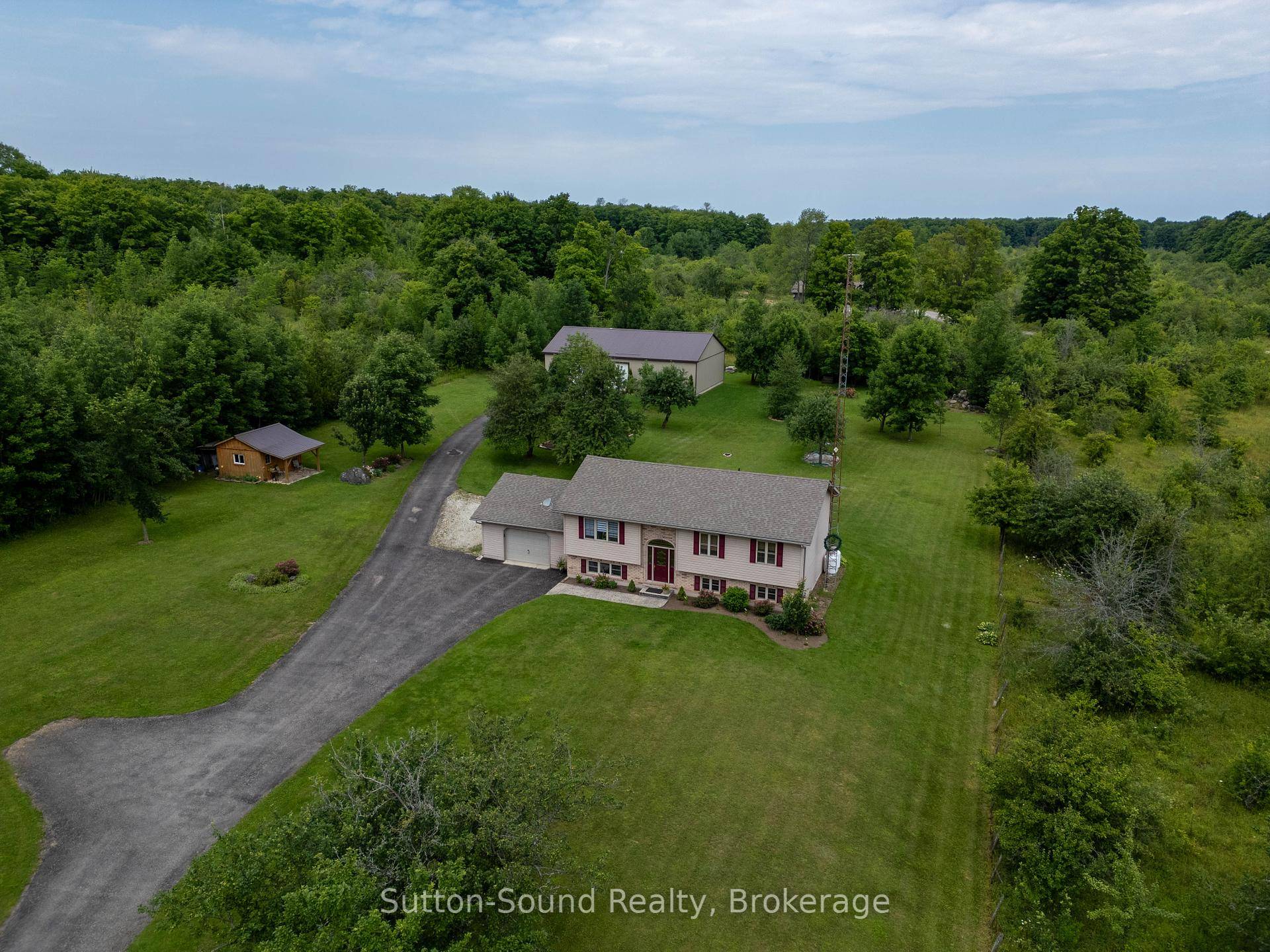 Nestled on 1. 97 acres of picturesque countryside central to Wiarton and Owen Sound, this charming 4bedroom 3 bathroom home offers privacy, space, and modern comforts.