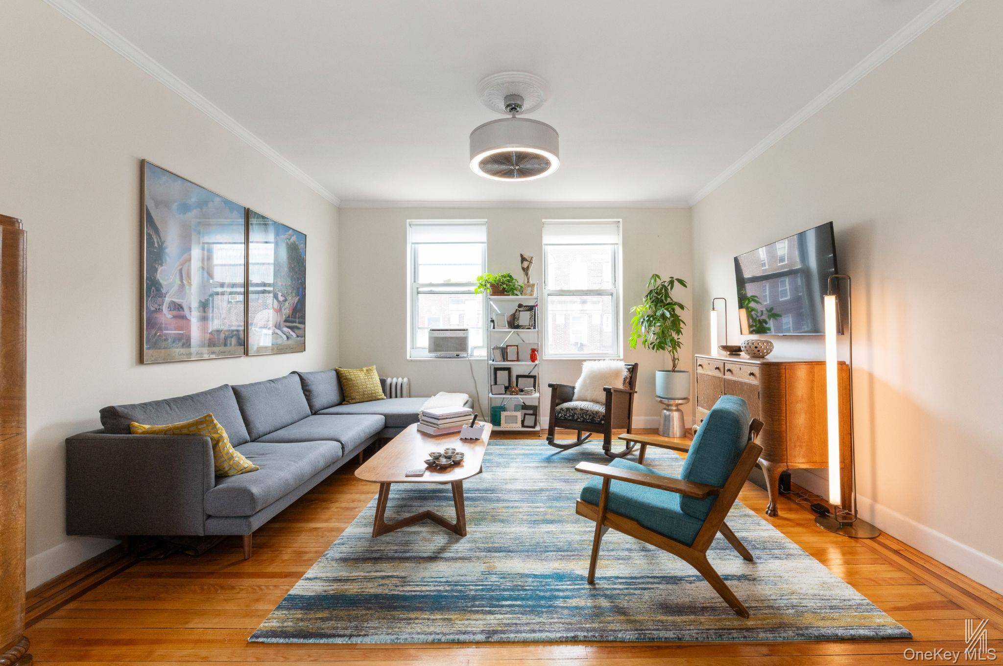 Bathed in eastern, western, and southern light, this top floor apartment in The Colonials offers the perfect blend of prewar charm and modern renovation.