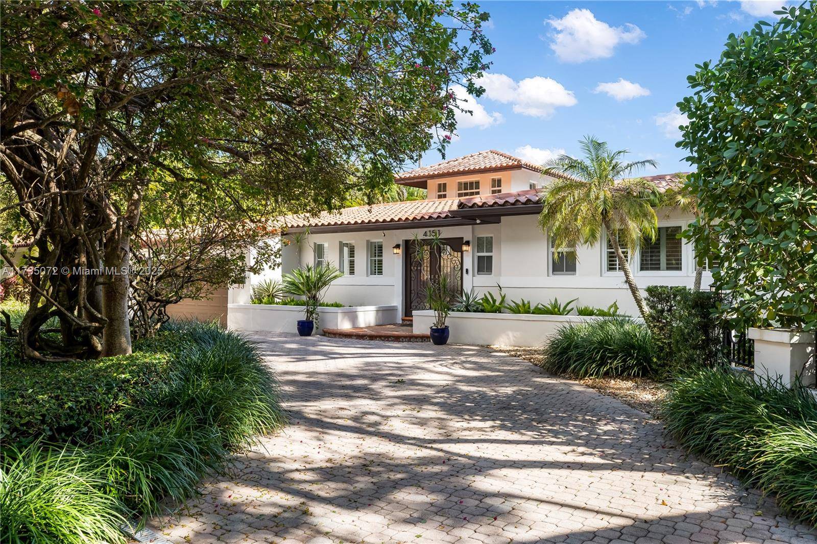 This stunning Coral Gables residence, located on a prime corner lot in the Italian Village, seamlessly blends luxury and comfort.