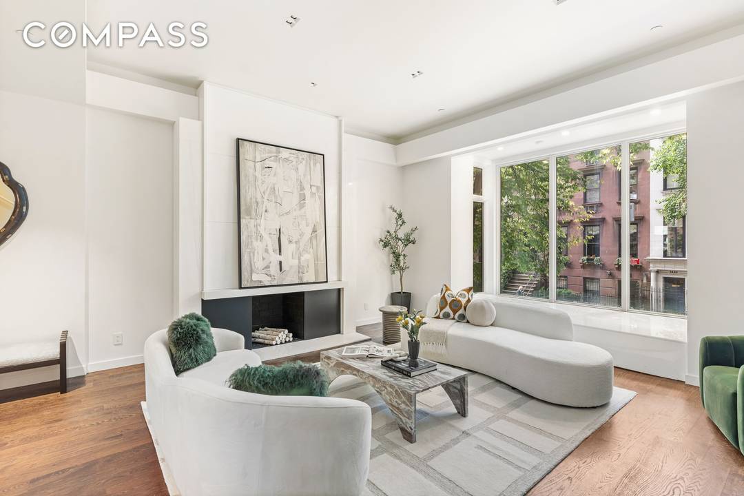 Upon entering this beautiful townhouse from the street level, you step into a spacious tiled foyer.