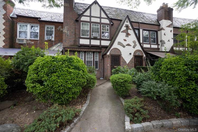 Charming Tudor Townhouse Rental in Forest Hills nestled on a gorgeous tree lined street in one of Forest Hills' most storied enclaves.