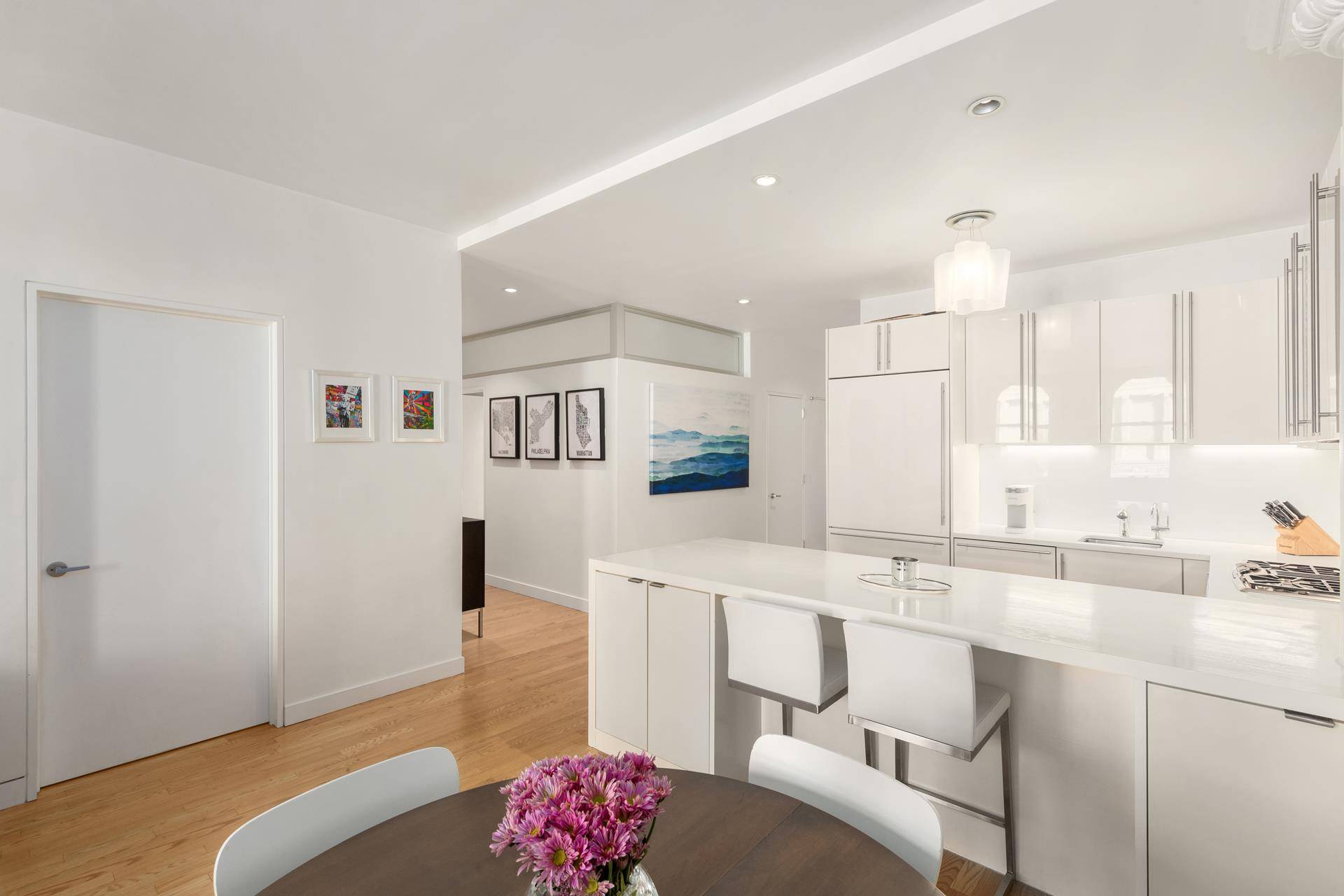 As you step in to residence 6E, a gracious entry foyer welcomes you to this quiet apartment with soaring 11 foot ceilings, hardwood floors throughout, recessed lighting, and oversized windows ...