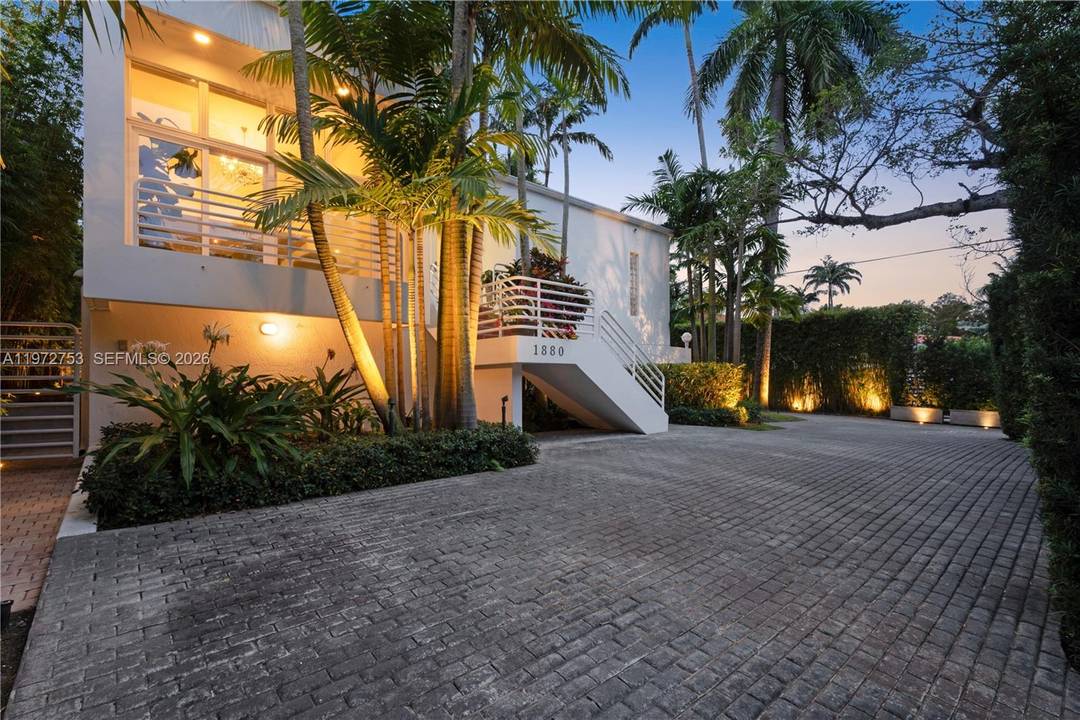 Perfectly positioned on iconic South Bayshore Drive, this private, gated residence offers an exceptional Coconut Grove lifestyle moments from Brickell.