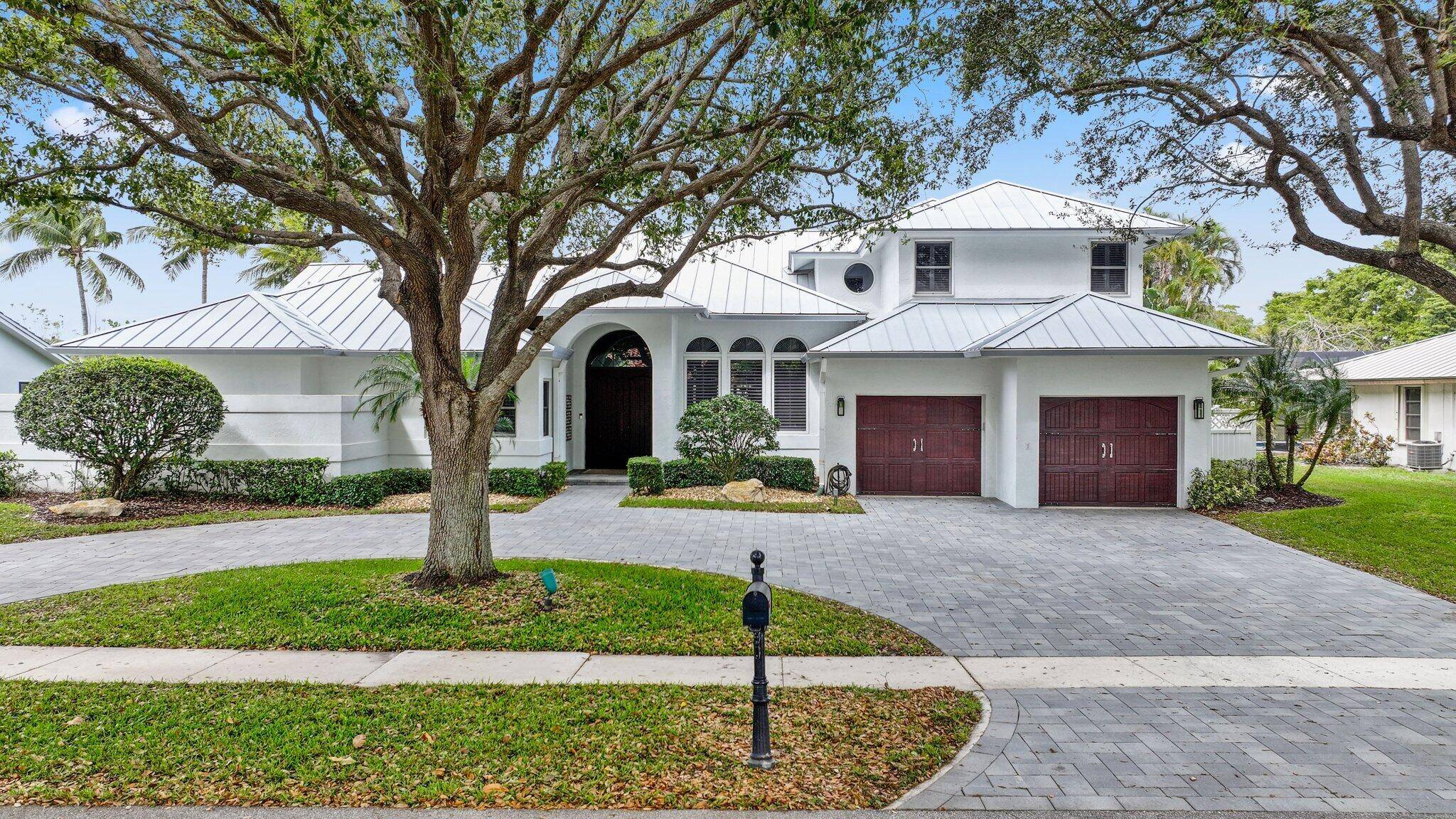 This is a remarkable opportunity to acquire a spacious five bedroom, five and a half bathroom home situated on one of the most desirable lots in the Boca Bath and ...