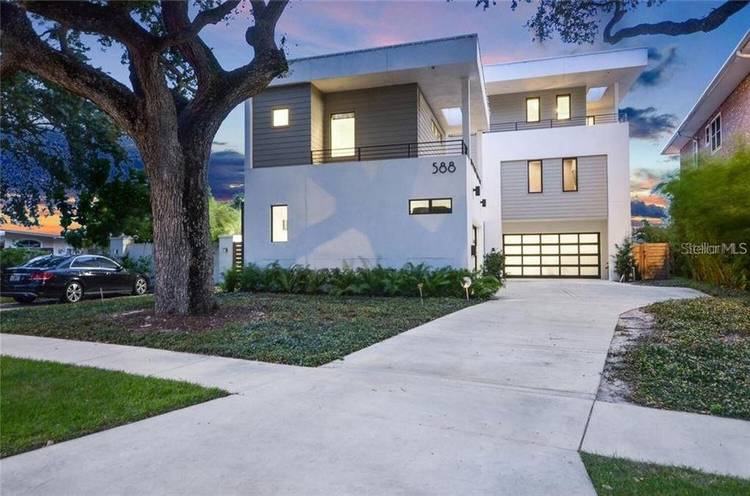 Experience luxury waterfront living on one of Davis Islands' most coveted streets in this stunning contemporary custom home with incredible open Bay views.