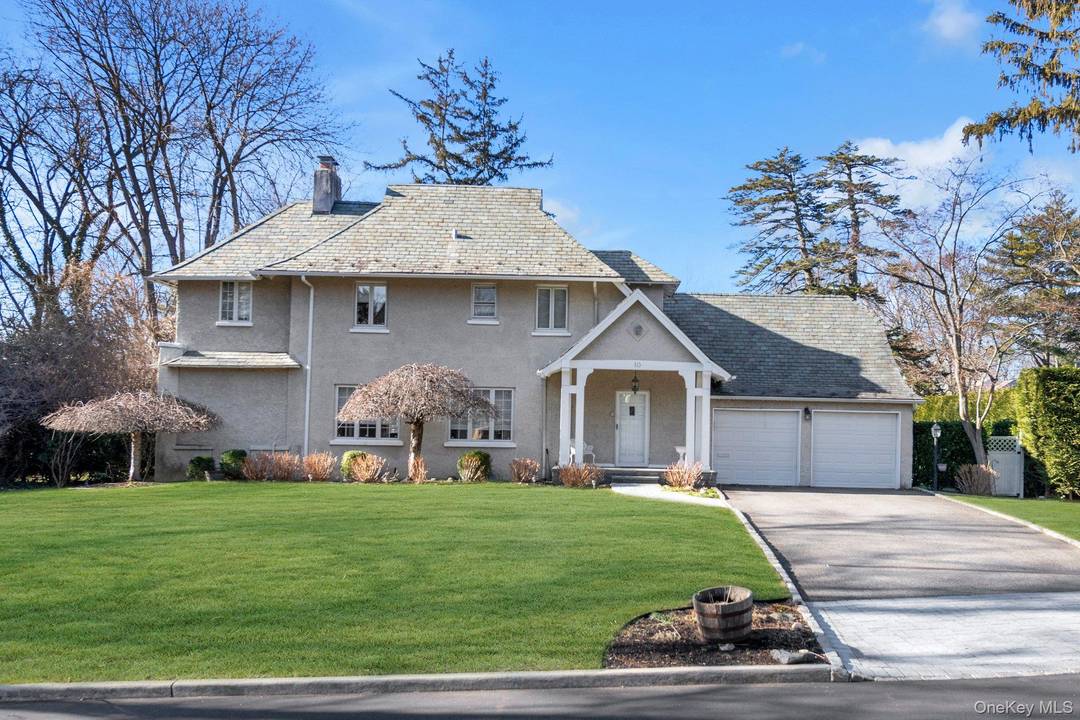 This Great Neck Estates side hall colonial blends timeless architectural character with thoughtfully integrated modern upgrades.