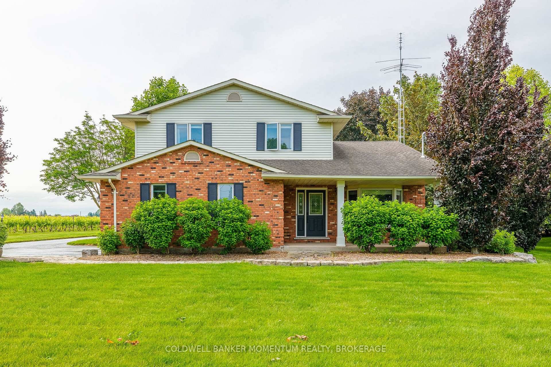 ABSOLUTELY STUNNING ! This beautiful home in tranquil Niagara on the Lake sits on 1.