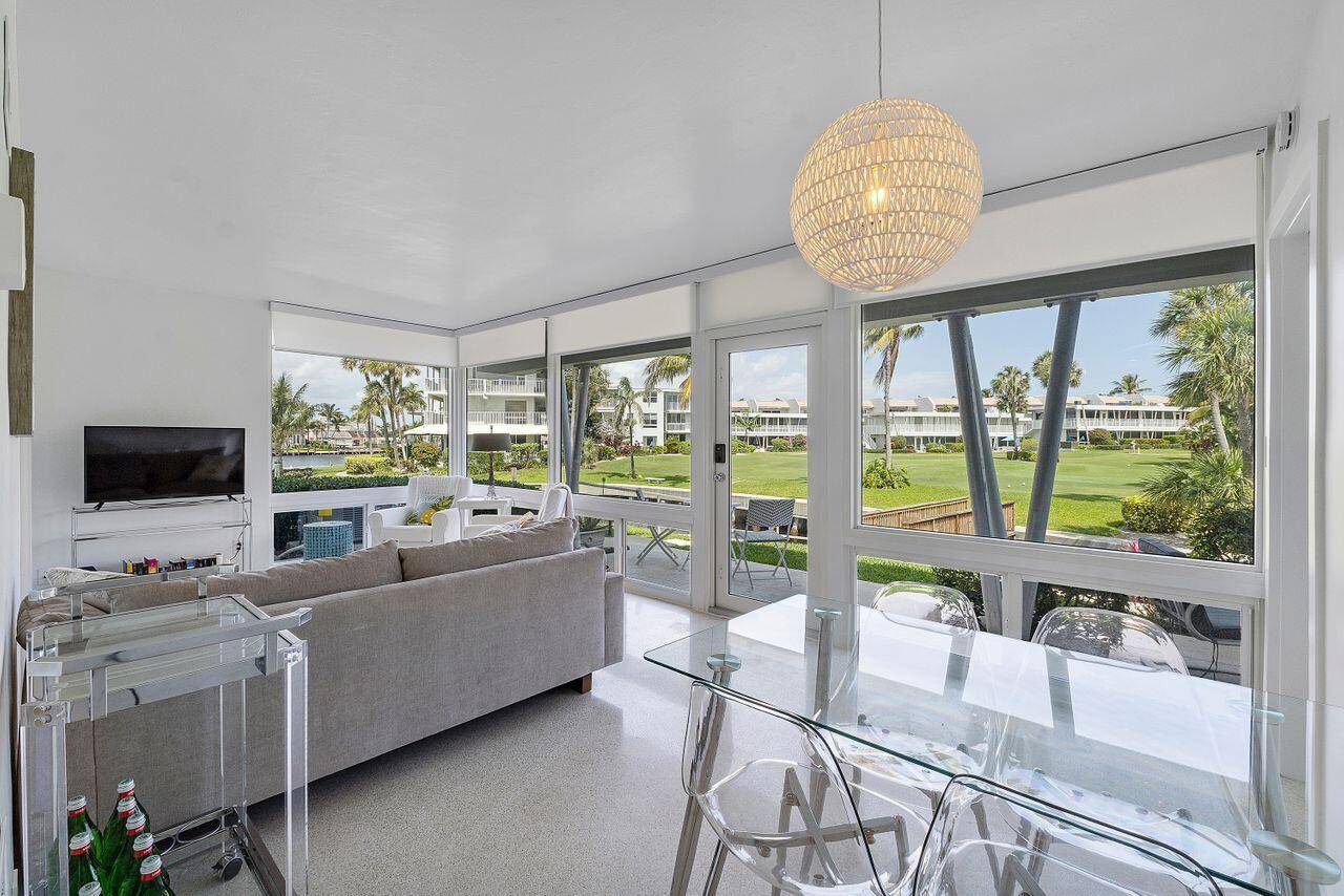 This gorgeous corner residence offers sweeping views of the golf course, marina and Intracoastal.