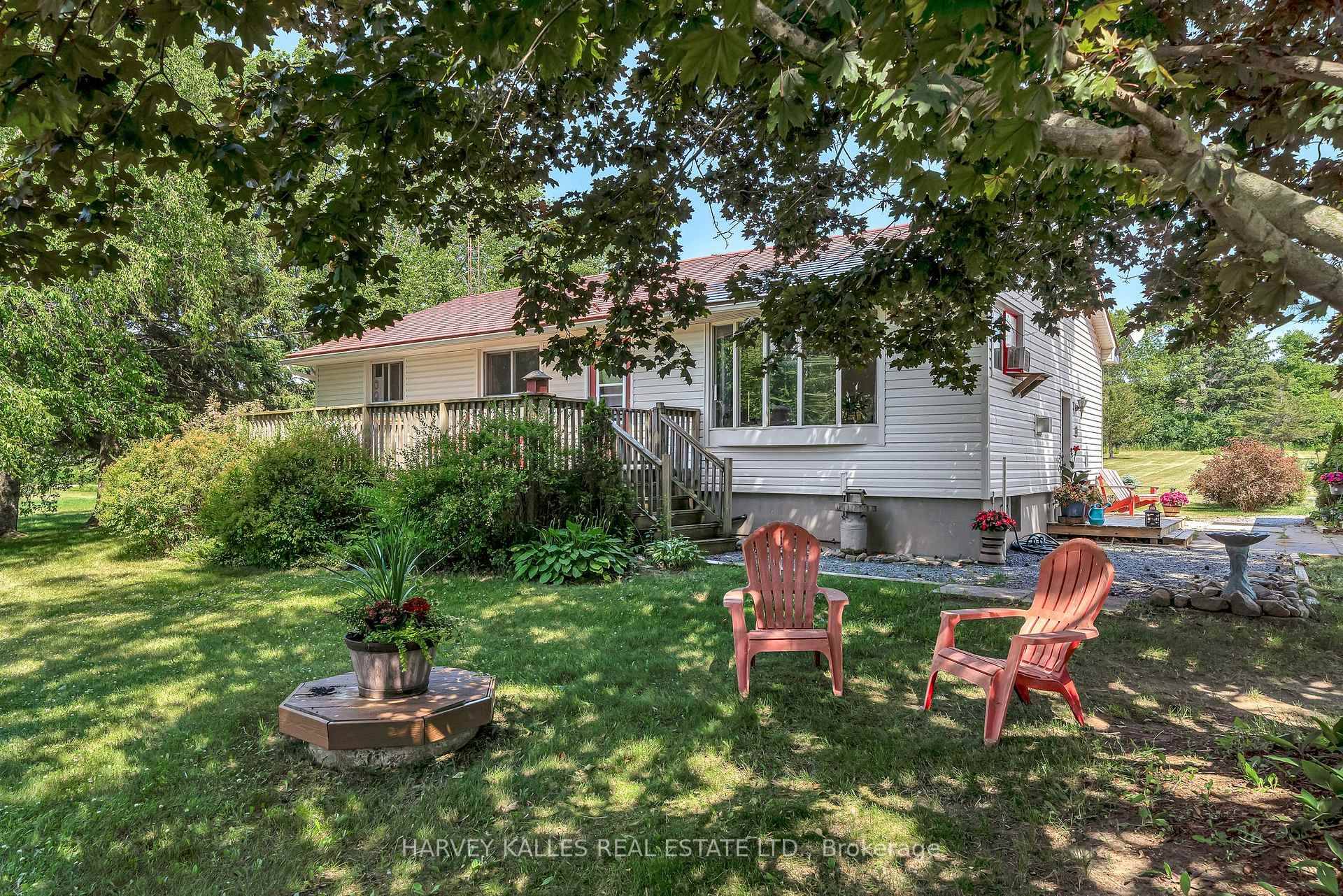 Just minutes from Sandbanks Provincial Park, this rural bungalow rests on a picturesque 1.