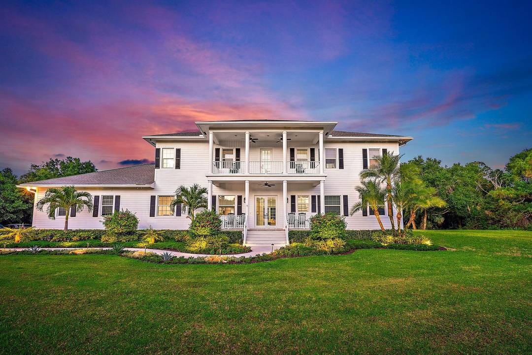 Discover an exceptional lifestyle at this private gated estate in the heart of Jupiter Farms.