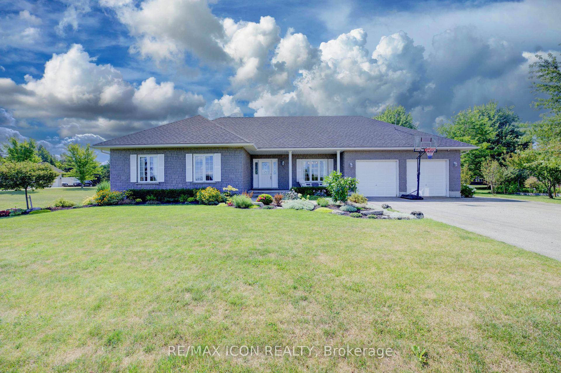 Welcome to this stunning all stone bungalow, beautifully situated in an executive estate subdivision just minutes from Pike Lake Golf Course.