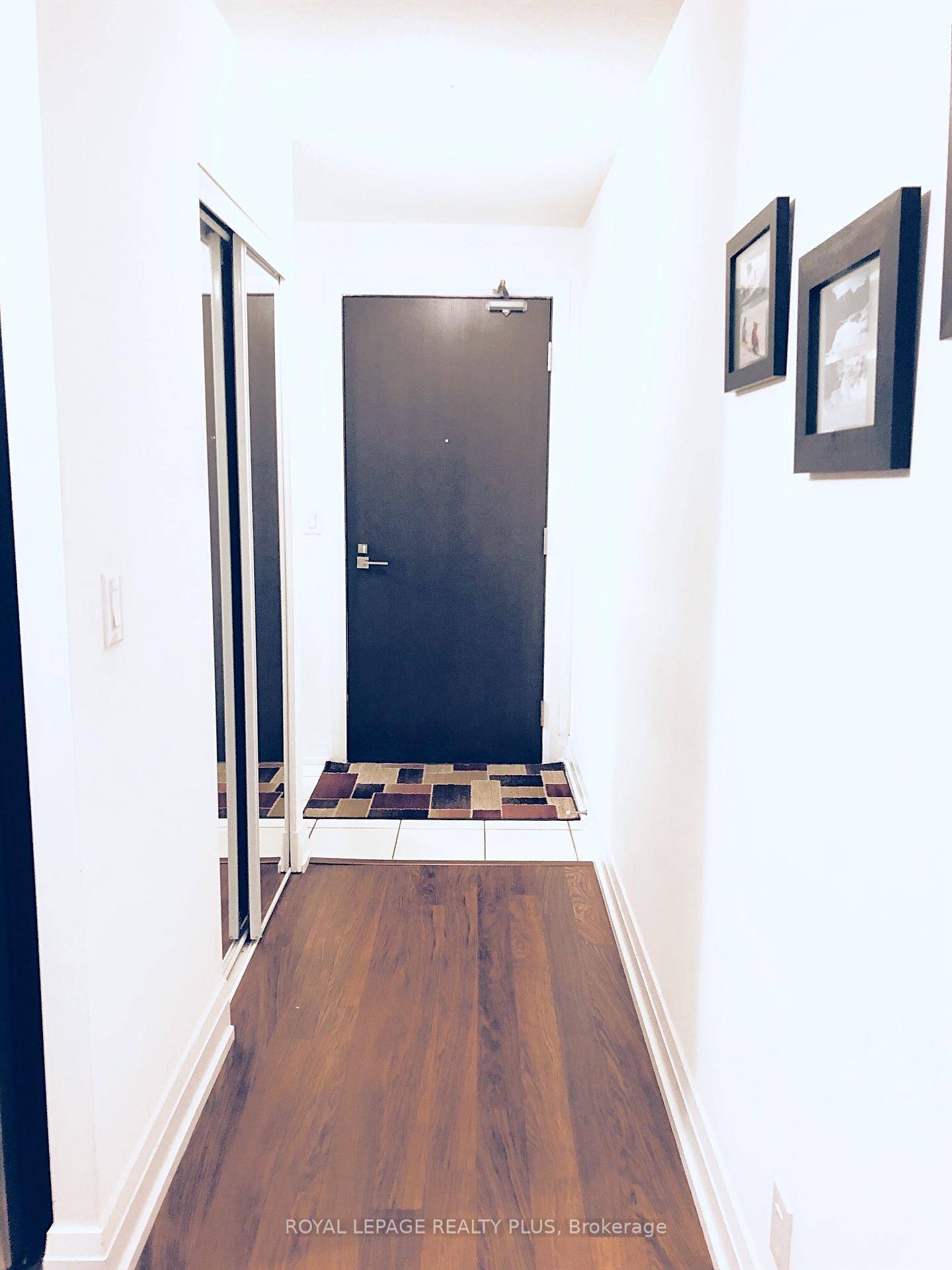 Stylish 1 bedroom condo for lease featuring a modern kitchen with stainless steel appliances and an island.
