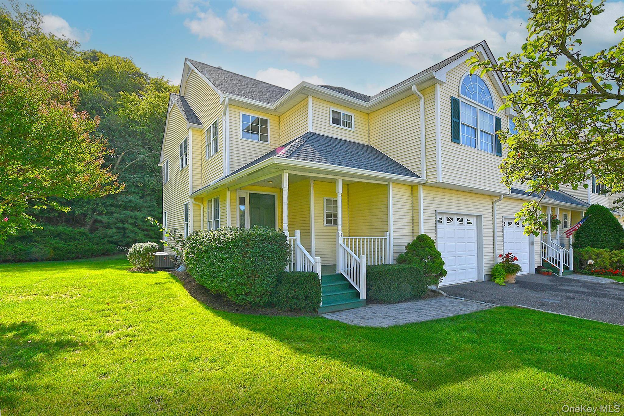 Welcome to 11 Spring Court, a beautiful corner unit featuring an updated open layout.