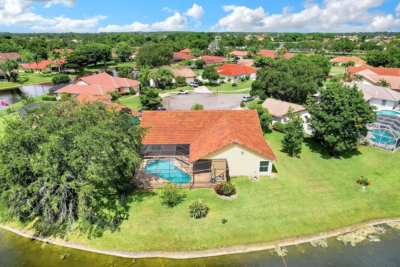 This spacious 4 bedroom, 2 bathroom lakefront pool home offers a bright, open feel with stunning views of the pool and lake from almost every room.