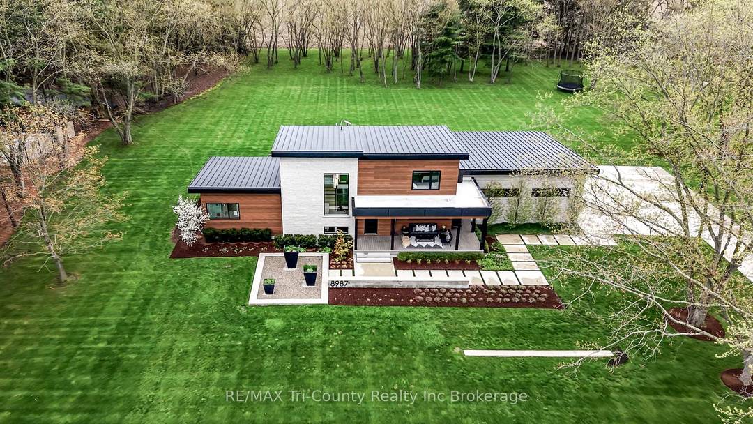 Set on a private 6 acre estate surrounded by mature pines, this custom built residence offers a rare blend of refined living, natural beauty, and exceptional versatility.