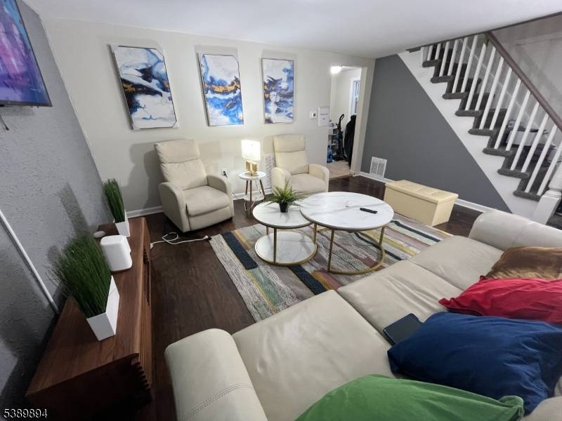 Welcome to this stunning townhouse style duplex apartment that perfectly combines modern design and practicality.