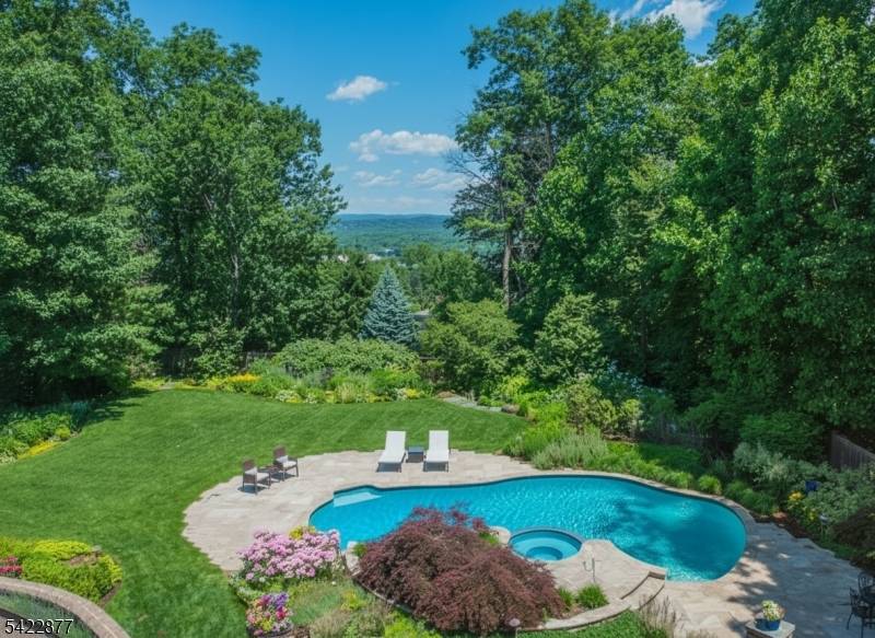 Live like you ? re on vacation every day in this modern North Caldwell estate, where bold design meets resort style luxury.