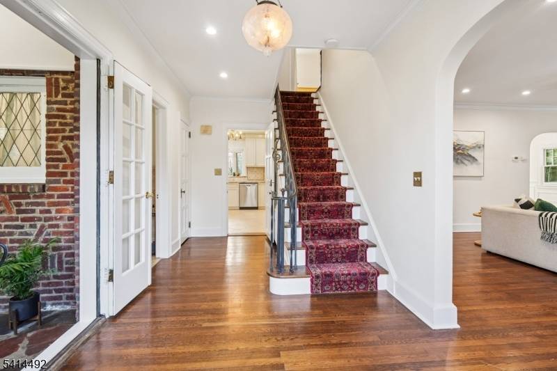 Gracious Tudor style home in the highly sought after Upper Wyoming neighborhood offering 4 bedrooms, 2 full, 2 half baths plus three car garage.