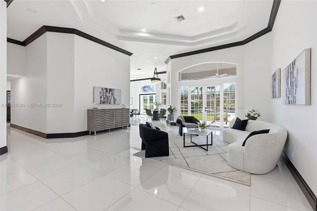 Set within the gated enclave of Emerald Springs Estates, this modern elegance is on the community s largest lot with 1.