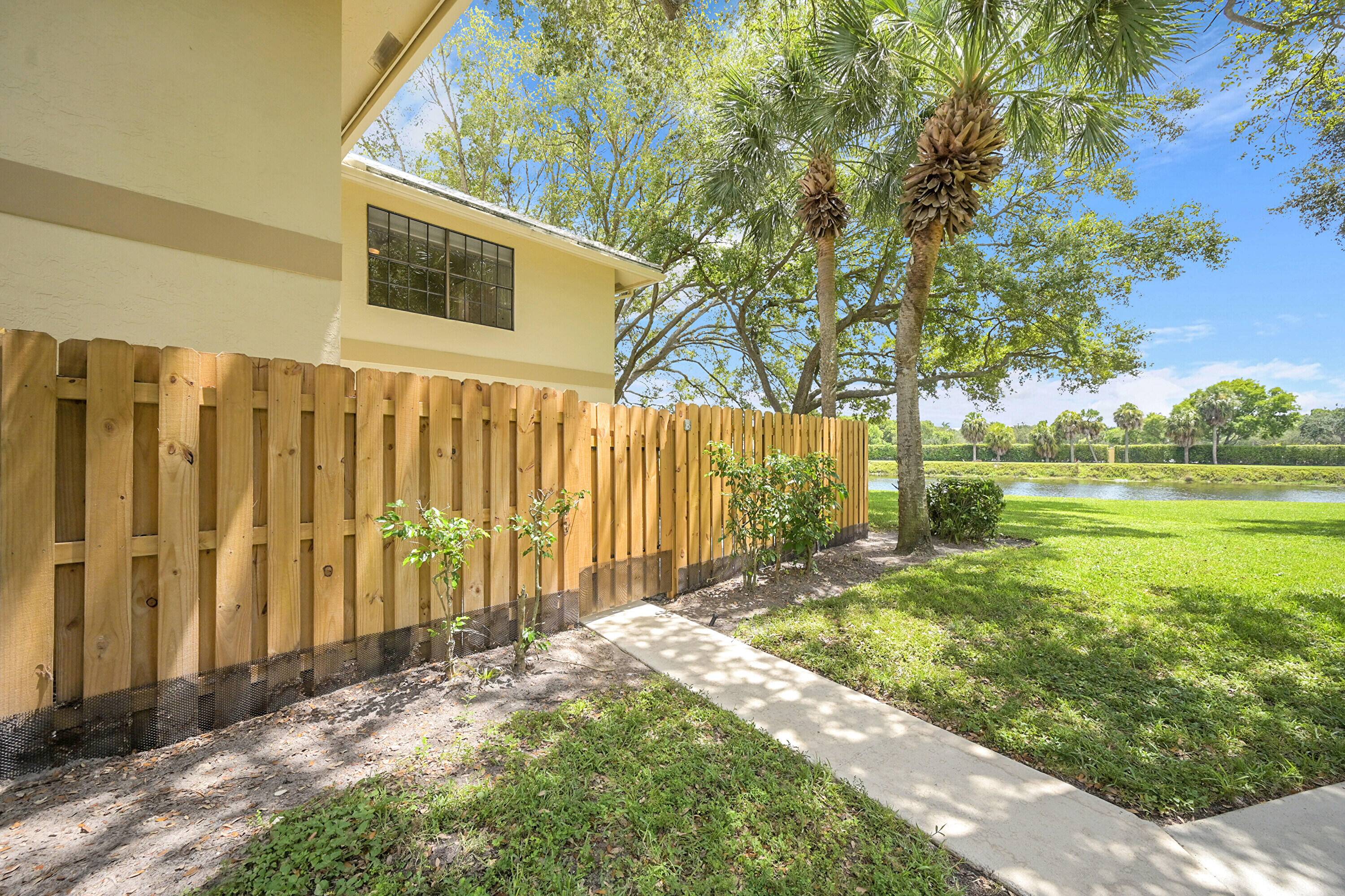Experience luxury in this stunning, COMPLETELY designer renovated corner unit townhome in Delray Beach.