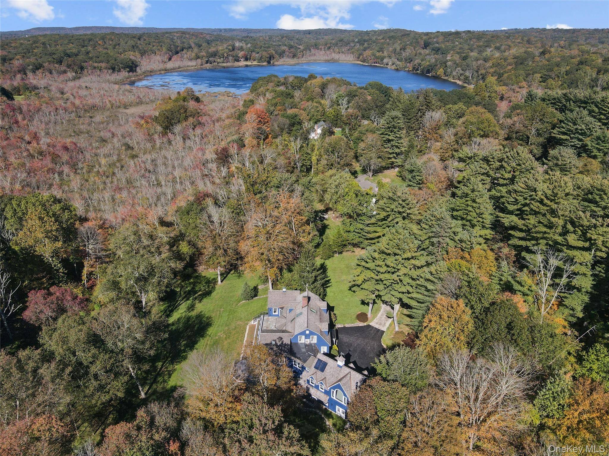 Ensuring privacy with in town convenience, this Pound Ridge home is beautifully sited on over 3 acres with incredible vistas, deeded lake rights, bordering 35 acres of protected Pound Ridge ...