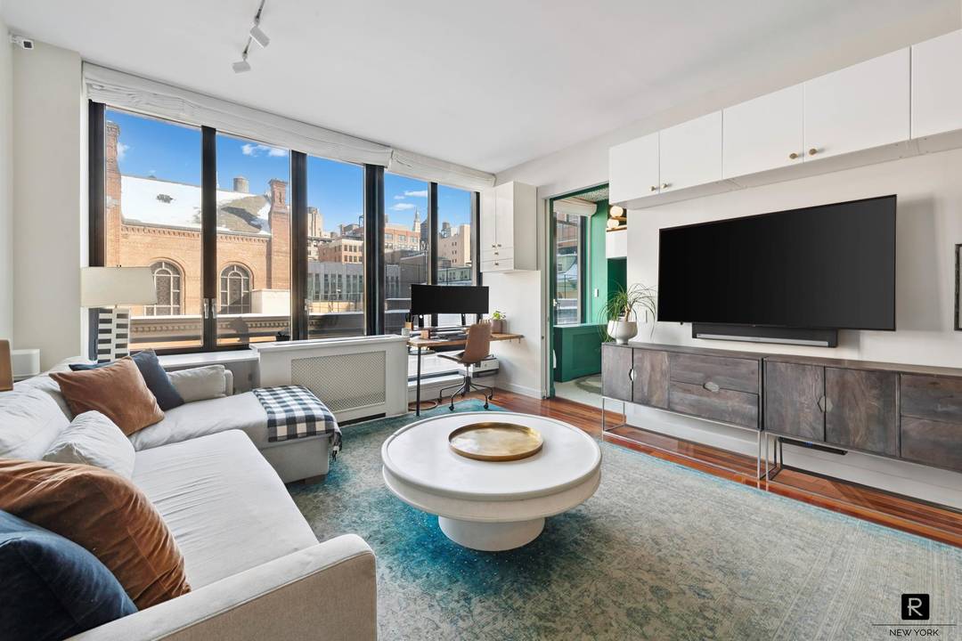 Corner two bedroom with open northern and eastern exposures, oversized windows, and a bright, airy layout just steps from Union Square.