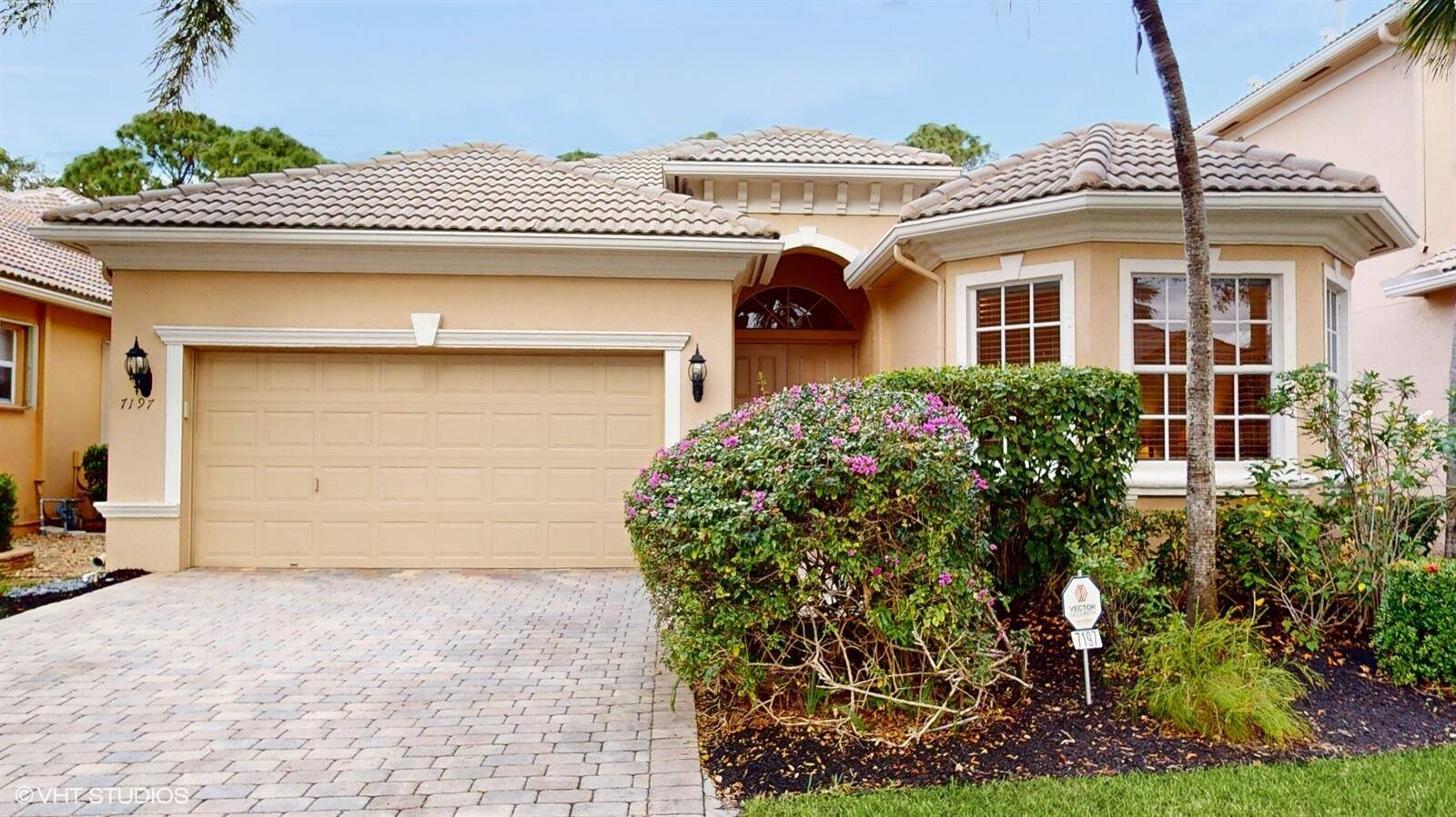 Discover the elegance of this lovely Alicante model, nestled in the 55 community of Mizner Falls.