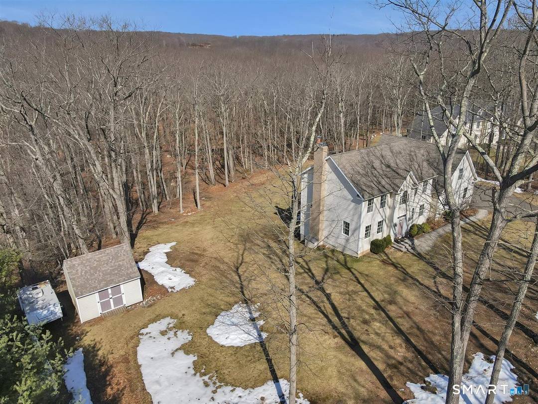 Nestled on a quiet deadend street among a collection of custombuilt homes, this stately colonial enjoys a rare frontrow view of more than 500 acres of protected state land.