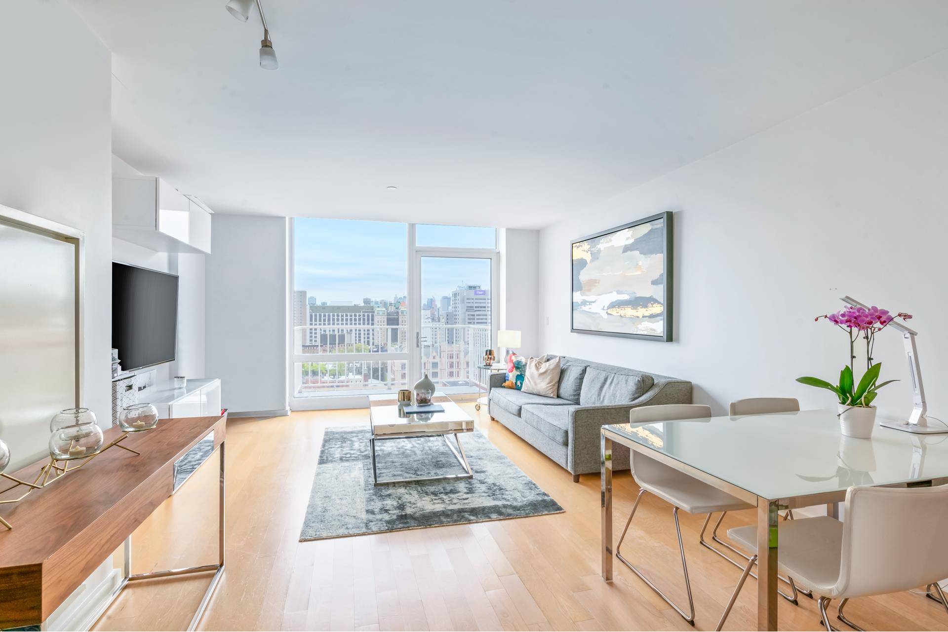 New To Market Sublime and Sun Flooded 2 Bedroom 2 Bath residence with open southern views at the Gramercy Starck Condominium.