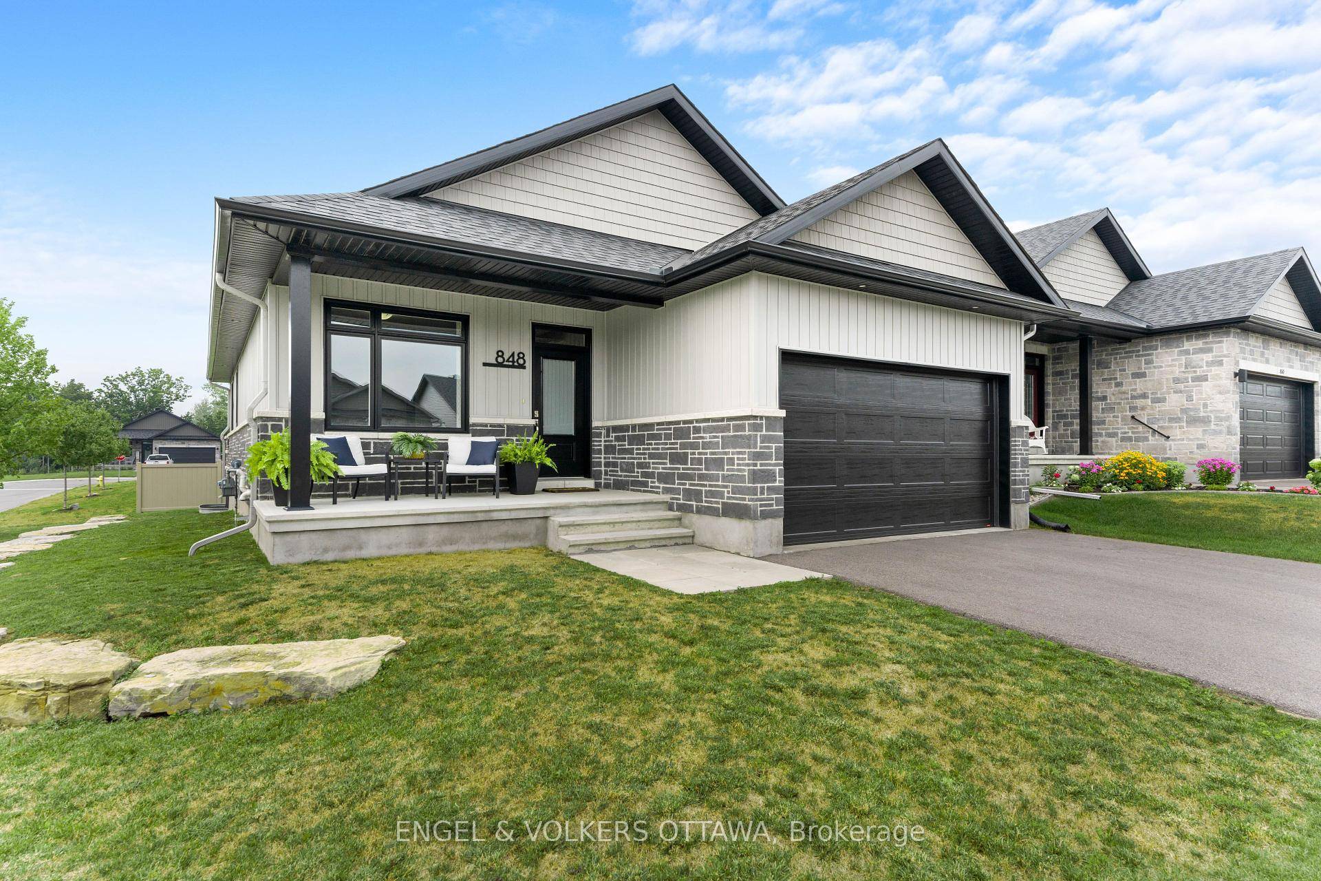 Welcome to 848 Reaume Street, a beautifully upgraded Neilcorp bungalow located on a large corner lot in Almonte.