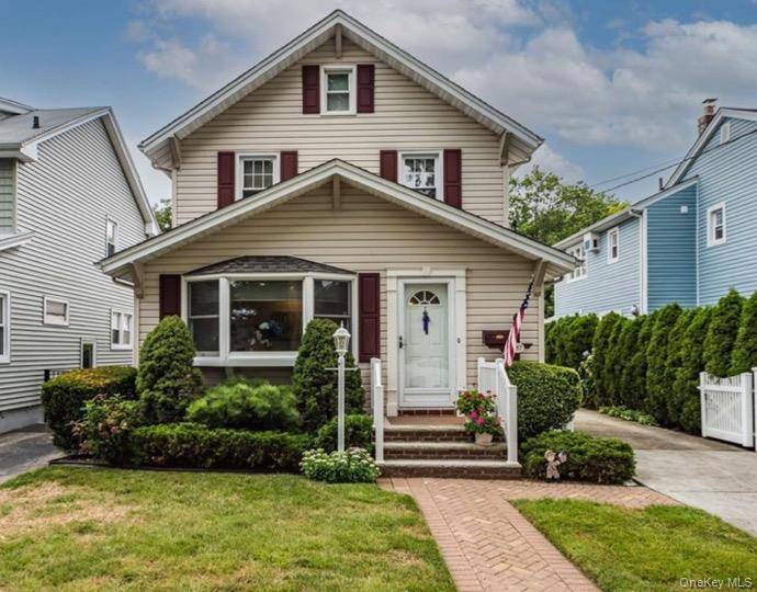 Discover timeless charm in this beautifully updated Colonial nestled in the heart of the Village of Floral Park.