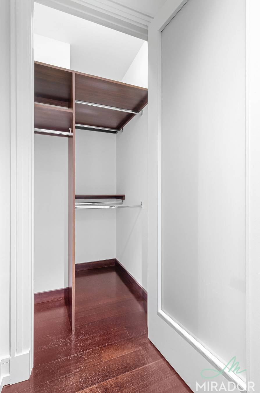 This massive studio home office features an in home Miele washer dryer, renovated kitchen with Viking and Sub Zero appliances, and Italian marble countertops.