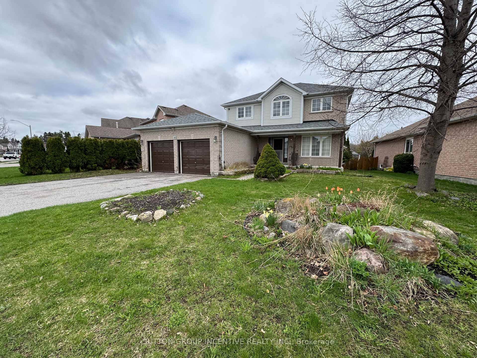 A LARGE HOME ON POPULAR COUNTRY LANE BACKING ON TO PROTECTED GREENSPACE LOVERS CREEK WITH AN EXTRA WIDE LOT.