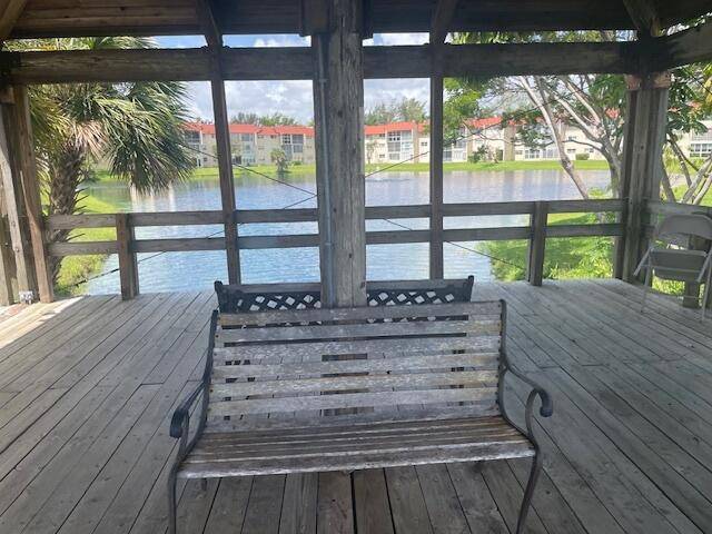 Second Floor Condo in 55 Sunrise Lakes Phase 1 with tranquil lake view from back patio.