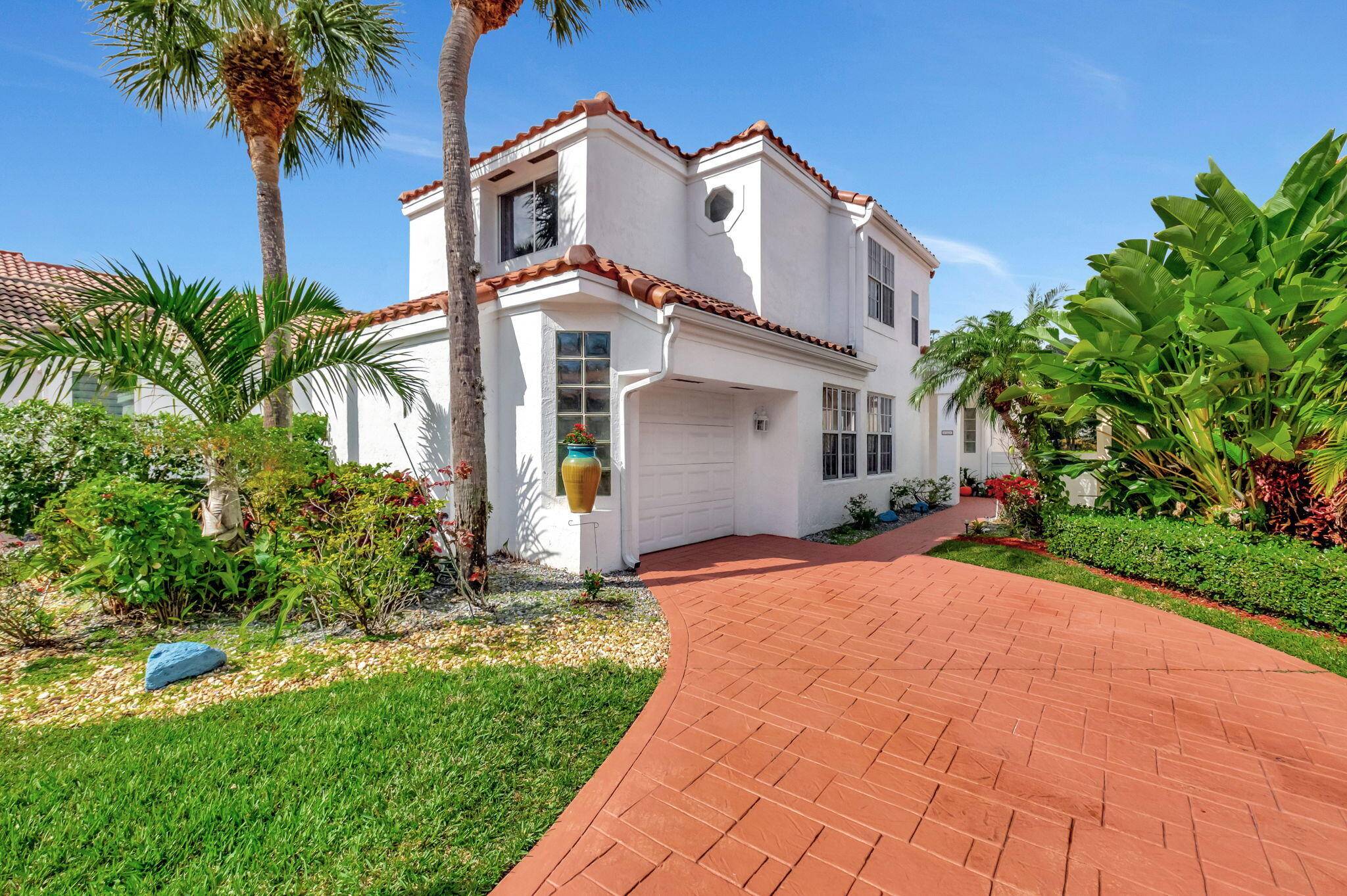 Nestled in the highly desirable Boca Country Club, this beautiful home offers stunning golf course views and a spacious, light filled layout.